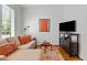 Inviting living room featuring a comfortable sofa, stylish decor, and media center at 145 Cofield Cir, Durham, NC 27707