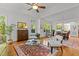 Bright and airy living room featuring hardwood floors, neutral tones, and access to the outdoors at 145 Cofield Cir, Durham, NC 27707
