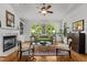 Cozy living room featuring a fireplace, built-in shelving, and hardwood floors at 145 Cofield Cir, Durham, NC 27707