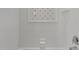 Clean tiled shower features a geometric accent tile design and classic fixtures at 145 Cofield Cir, Durham, NC 27707