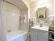 Cozy bathroom featuring a shower-tub combo and vanity with storage at 1512 St. Mary'S St, Raleigh, NC 27608