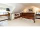 Attic bedroom featuring a bed, desk and chair, and natural light from a dormer window at 1512 St. Mary'S St, Raleigh, NC 27608