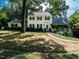 Traditional two-story home with a brick walkway, manicured landscaping, and charming curb appeal at 1512 St. Mary'S St, Raleigh, NC 27608