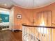 Elegant hallway with hardwood floors, staircase, chandelier and doorway to bedroom at 1512 St. Mary'S St, Raleigh, NC 27608