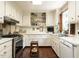 Functional kitchen featuring ample counter space, white cabinetry, and modern appliances at 1512 St. Mary'S St, Raleigh, NC 27608