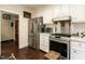 Contemporary kitchen equipped with stainless steel appliances, sleek cabinetry, and modern fixtures at 1512 St. Mary'S St, Raleigh, NC 27608