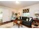 Comfortable living room with a cozy sofa, wood floors, and natural light at 1512 St. Mary'S St, Raleigh, NC 27608