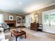 Charming living room with a fireplace, built-in bookshelves, and classic furnishings at 1512 St. Mary'S St, Raleigh, NC 27608