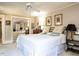 Comfortable bedroom featuring neutral walls, ceiling fan, mirrored closet, and ample natural light at 1512 St. Mary'S St, Raleigh, NC 27608