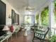 Relaxing covered porch with comfortable seating and lush greenery at 1512 St. Mary'S St, Raleigh, NC 27608