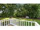 View from back deck showing spacious grassy yard with shed and mature trees at 163 Lake Latham Rd, Mebane, NC 27302