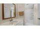 Bathroom with a vanity, mirror, and tiled shower-tub combination at 163 Lake Latham Rd, Mebane, NC 27302