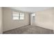 Well-lit bedroom featuring neutral carpet, walls, and window at 163 Lake Latham Rd, Mebane, NC 27302