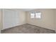 Bedroom featuring a large closet, neutral walls, and carpeting at 163 Lake Latham Rd, Mebane, NC 27302