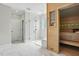 Modern bathroom featuring a glass shower, sauna, and light marble flooring at 164 Avocet Ln, Clayton, NC 27520