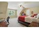 Bedroom with a window, neutral colored walls, carpet, and a ceiling fan at 164 Avocet Ln, Clayton, NC 27520