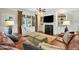 Cozy living room with a fireplace, built-in shelves, and comfortable seating at 164 Avocet Ln, Clayton, NC 27520