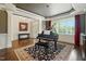 Elegant living room with hardwood floors, piano, and coffered ceilings at 164 Avocet Ln, Clayton, NC 27520