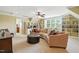 Comfortable living room with a large sectional couch, built-in bookshelves, and a view to the outside at 164 Avocet Ln, Clayton, NC 27520