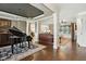 Open-concept living area with hardwood floors and decorative columns at 164 Avocet Ln, Clayton, NC 27520