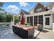 Beautiful covered deck with comfortable seating and an open view of the yard at 164 Avocet Ln, Clayton, NC 27520