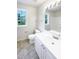 A bathroom features a vanity, toilet, and shower, with a window for natural light at 17 Ballard Ct, Durham, NC 27712