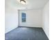 Bedroom offers natural light from window and has neutral carpet at 17 Ballard Ct, Durham, NC 27712