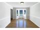 A dining room showcases hardwood floors and a bay window offering backyard views at 17 Ballard Ct, Durham, NC 27712