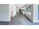 Bright kitchen featuring white cabinets, stainless steel appliances, and modern flooring at 17 Ballard Ct, Durham, NC 27712