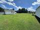 Large, grassy backyard offering ample space for recreation and potential landscaping opportunities at 1828 Fletchers Chapel Rd, Durham, NC 27703