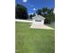 Detached one car garage set in the back yard with a new vinyl fence at 1828 Fletchers Chapel Rd, Durham, NC 27703