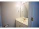Powder room with a vanity, sink, and a large mirror at 19 Cheltenham Dr, Clayton, NC 27520