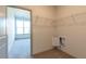 Walk-in closet featuring custom shelving and a convenient doorway to the bedroom at 2305 Gathering Sq Ct, Fuquay Varina, NC 27526
