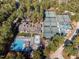 Overhead shot showcasing community amenities including tennis courts, a pool, and clubhouse at 23106 Umstead, Chapel Hill, NC 27517