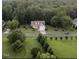 Beautiful aerial view of a home with lush green lawn and surrounding trees in a tranquil neighborhood at 237 Water Front Ln, Timberlake, NC 27583
