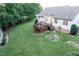Expansive backyard featuring a deck, brick accents, and a rock garden at 237 Water Front Ln, Timberlake, NC 27583