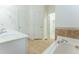 Bright bathroom with a soaking tub, a separate shower and walk-in closet at 237 Water Front Ln, Timberlake, NC 27583