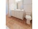 Double vanity in a bathroom with a large mirror and a toilet at 237 Water Front Ln, Timberlake, NC 27583