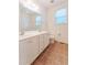 Bathroom features a double vanity with a large mirror and a toilet at 237 Water Front Ln, Timberlake, NC 27583