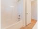 Clean white bathtub with shower and bathroom door at 237 Water Front Ln, Timberlake, NC 27583