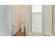 Bathroom view of a toilet next to a large walk-in closet at 237 Water Front Ln, Timberlake, NC 27583