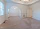 Neutral bedroom with neutral carpet and an archway separating it from the rest of the house at 237 Water Front Ln, Timberlake, NC 27583