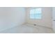 Bright bedroom featuring 2 windows and neutral carpet at 237 Water Front Ln, Timberlake, NC 27583