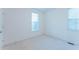 An empty bedroom is lit up with lots of natural light at 237 Water Front Ln, Timberlake, NC 27583