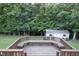 Spacious outdoor deck with a built-in bench seating area and backyard views at 237 Water Front Ln, Timberlake, NC 27583