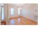 Bright dining room featuring hardwood floors, a chandelier, and decorative trim at 237 Water Front Ln, Timberlake, NC 27583