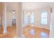 Bright dining room featuring hardwood floors, a chandelier, and decorative trim at 237 Water Front Ln, Timberlake, NC 27583