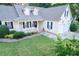 Charming home with a manicured lawn, covered porch, and an attached garage at 237 Water Front Ln, Timberlake, NC 27583