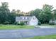 Charming two-story home with manicured lawn, two-car garage, and surrounded by lush trees at 237 Water Front Ln, Timberlake, NC 27583