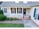 Charming porch with white railing and black shutters offering a warm welcome at 237 Water Front Ln, Timberlake, NC 27583